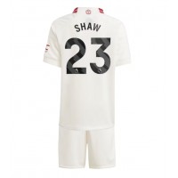 Camisa de Futebol Manchester United Luke Shaw #23 Equipamento Alternativo Infantil 2023-24 Manga Curta (+ Calças curtas)